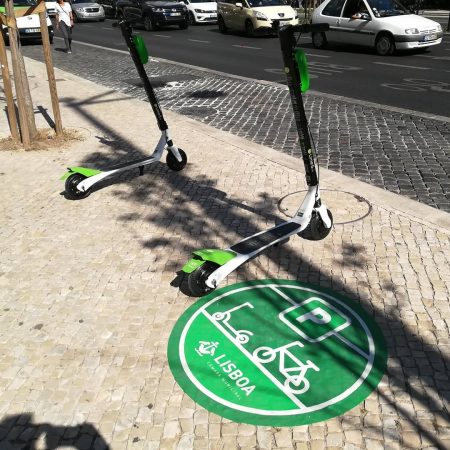 lime renting an electric scooter in Lisbon.jpeg