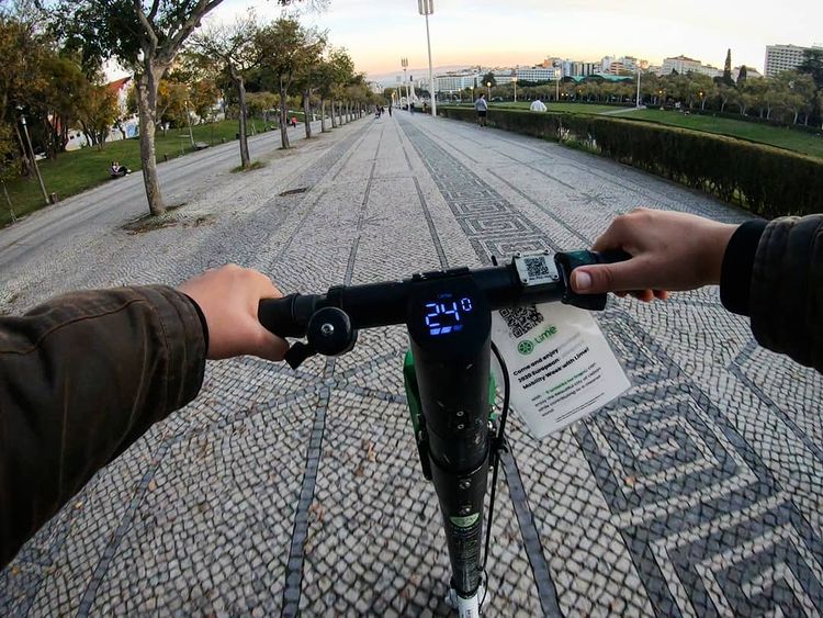 lime renting an electric scooter in Lisbon.jpeg